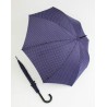 Long plain umbrella with white polka dots and cane