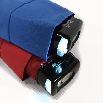 Small black umbrella with flashlight on handle